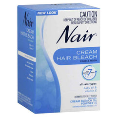 Nair hair bleach cream for face and body product packaging showing new look and dermatologically tested formula.