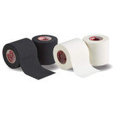 Mueller lightweight spatting tape in black and white rolls, perfect for securing cleats and padding.