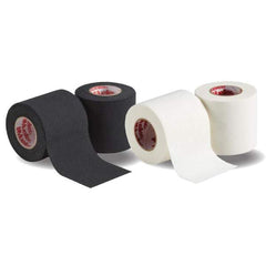 Mueller lightweight spatting tape in black and white rolls, perfect for securing cleats and padding.