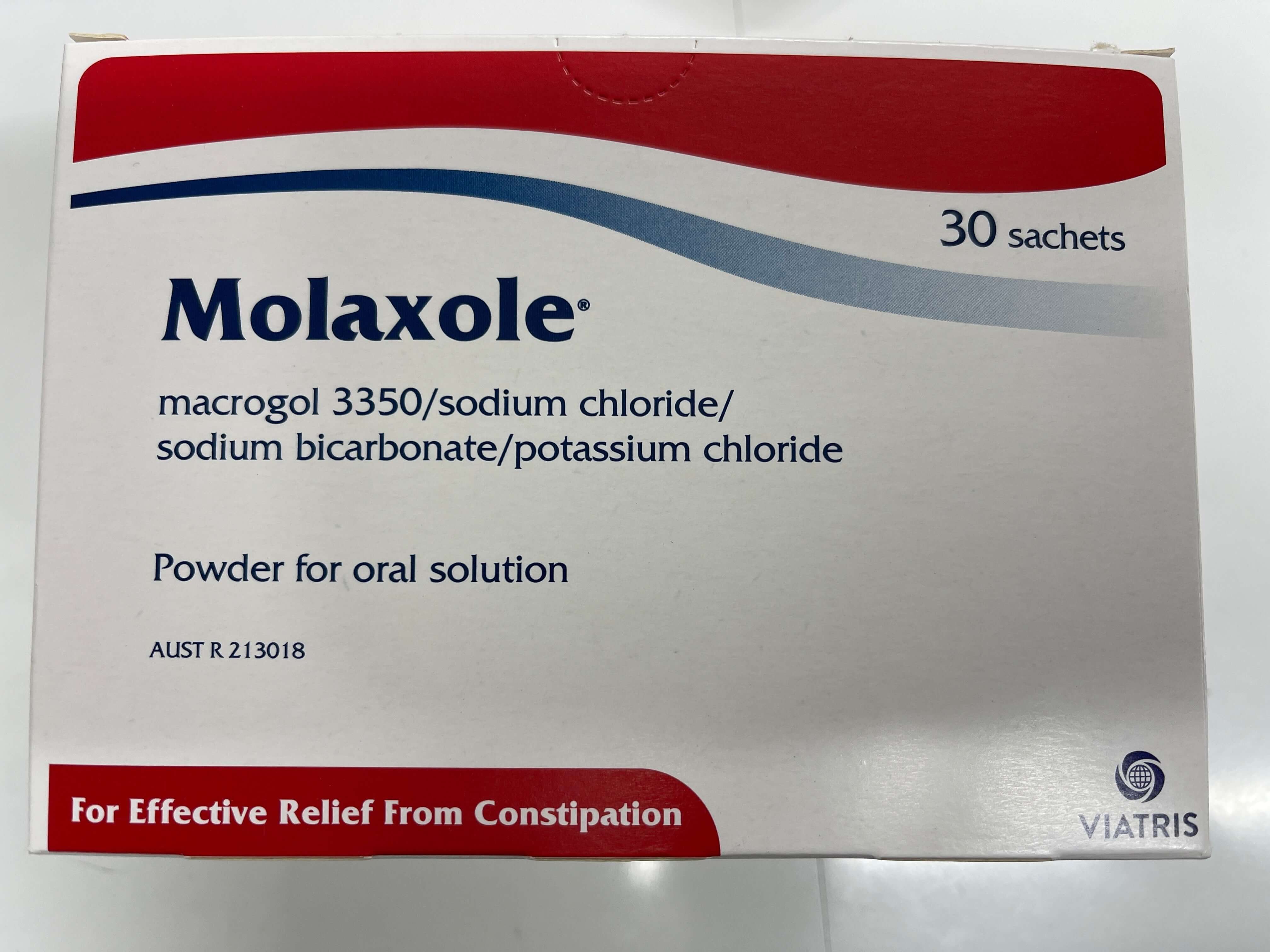 A box of Molaxole powder for constipation relief, with 30 sachets included. The packaging is primarily red and white with text detailing the product use and quantity.